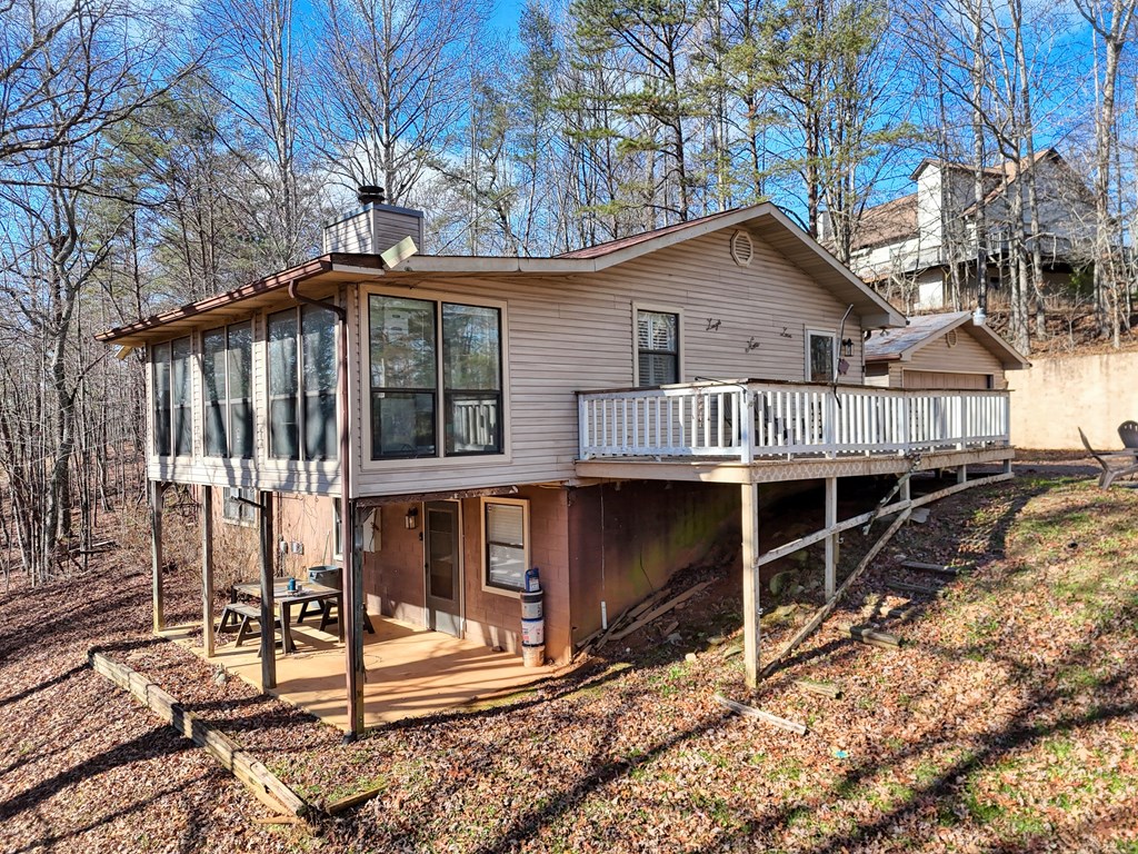131 Hickory Ridge Circle Hayesville, NC 28904 - Photo 2 of 35 a view of a house with wooden fence next to a road