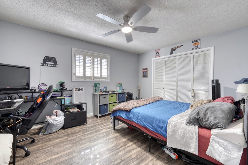 131 Hickory Ridge Circle Hayesville, NC 28904 - Photo 24 of 35 a bedroom with a bed and a chandelier