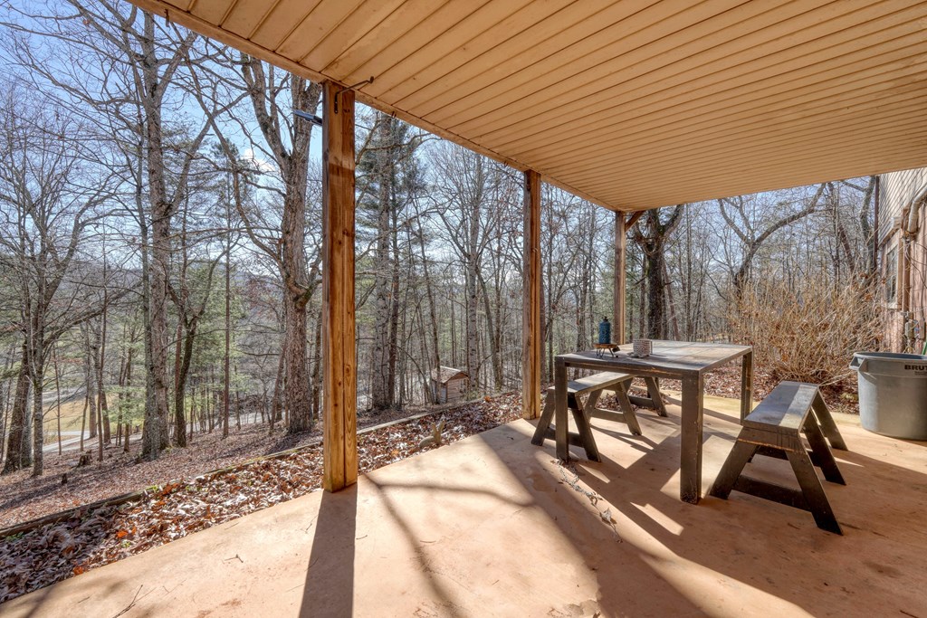 131 Hickory Ridge Circle Hayesville, NC 28904 - Photo 30 of 35 a patio with glass top table and chairs