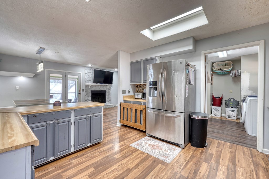 131 Hickory Ridge Circle Hayesville, NC 28904 - Photo 7 of 35 a kitchen with kitchen island wooden floors appliances and cabinets