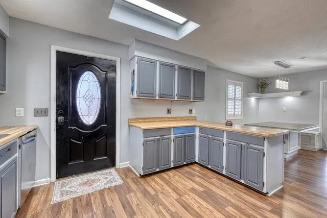 a spacious bathroom with a granite countertop sink and a mirror