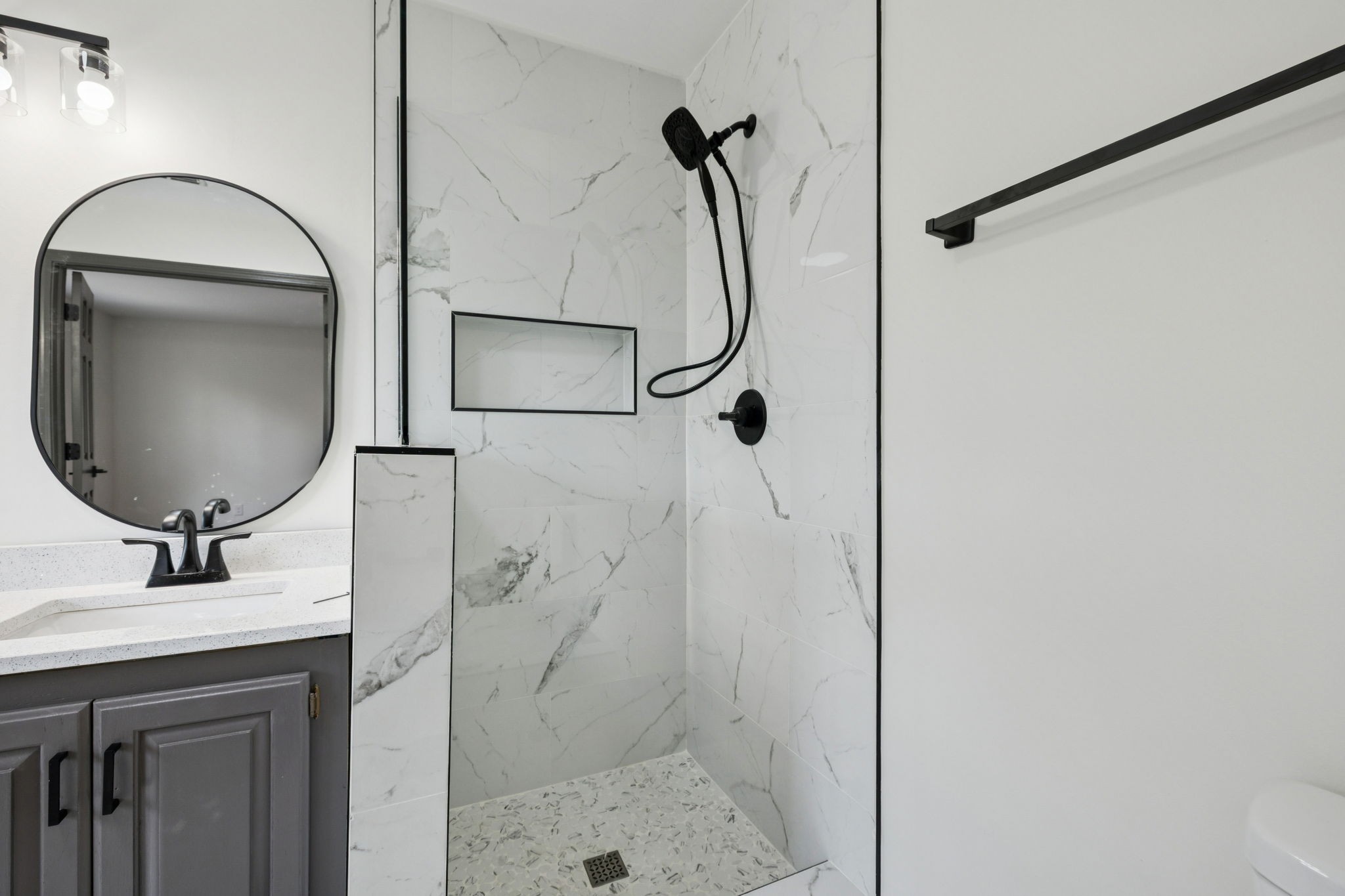 4612 Raccoon Trail Hermitage, TN 37076 - Photo 22 of 36 a bathroom with a sink a toilet and a mirror