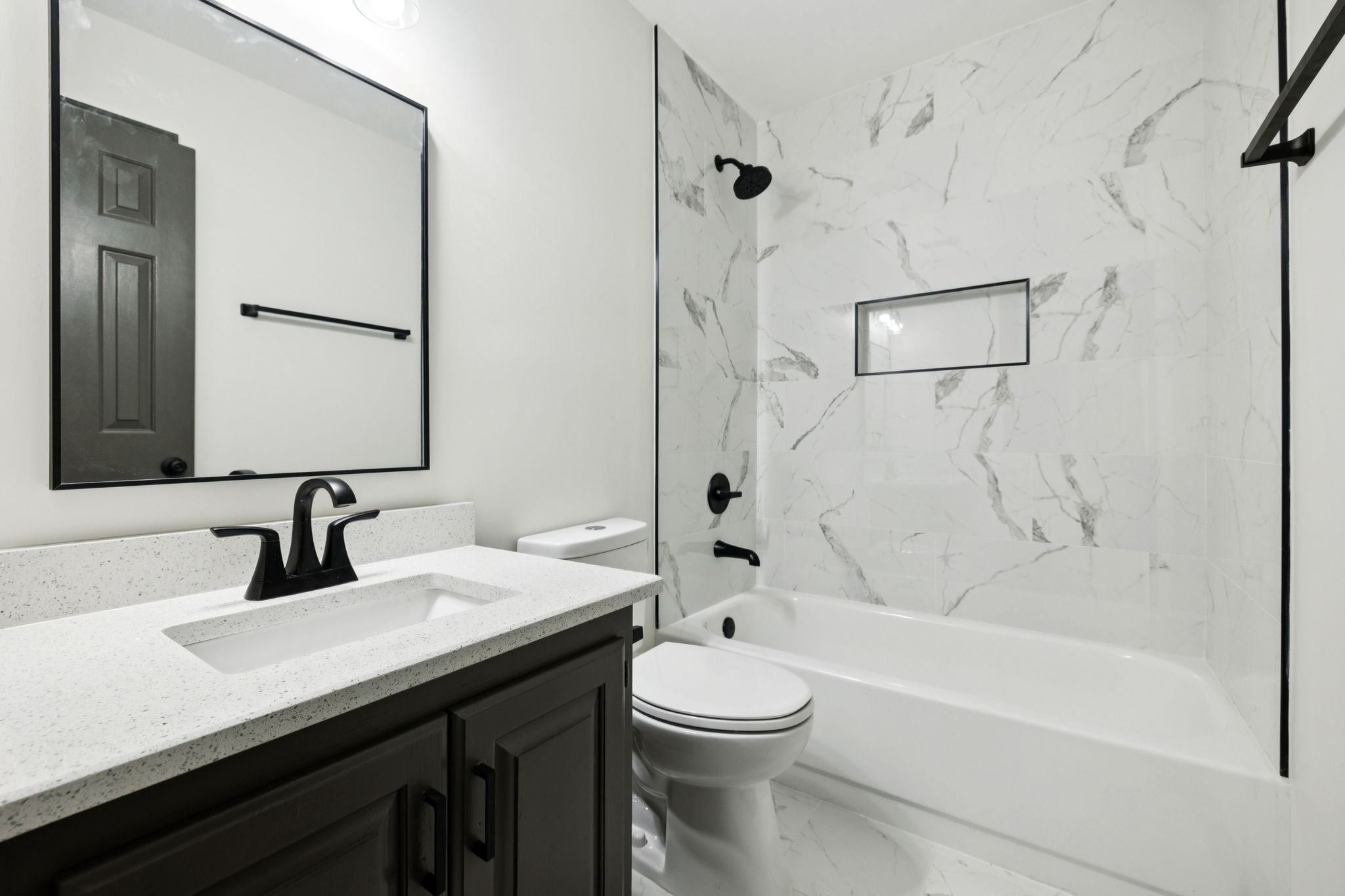 4612 Raccoon Trail Hermitage, TN 37076 - Photo 24 of 36 a bathroom with a sink a toilet and shower