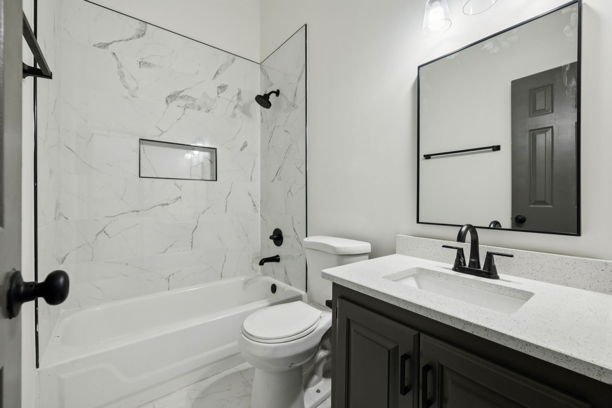 4612 Raccoon Trail Hermitage, TN 37076 - Photo 26 of 36 a bathroom with a sink a toilet and shower