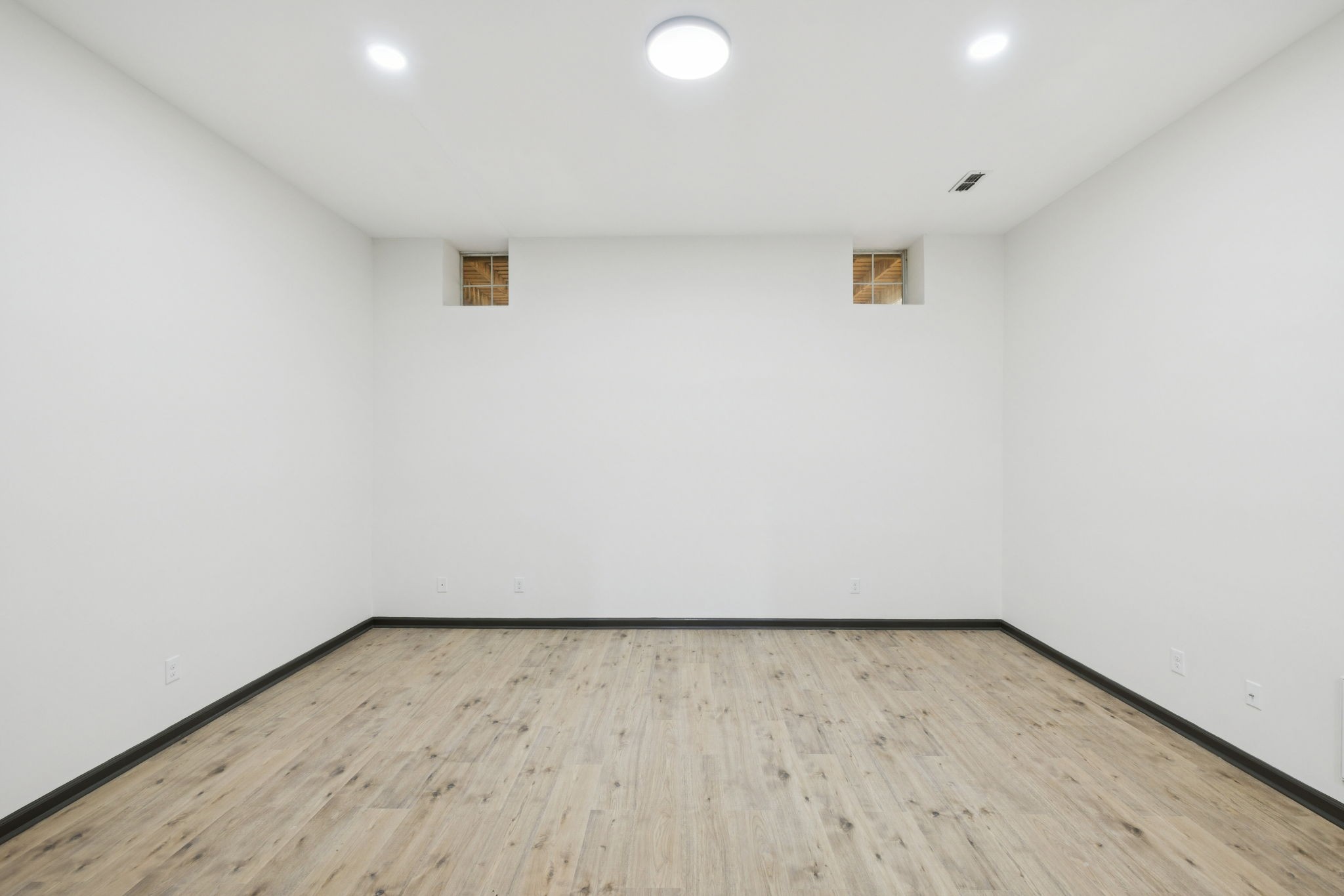 4612 Raccoon Trail Hermitage, TN 37076 - Photo 29 of 36 an empty room with wooden floor and windows