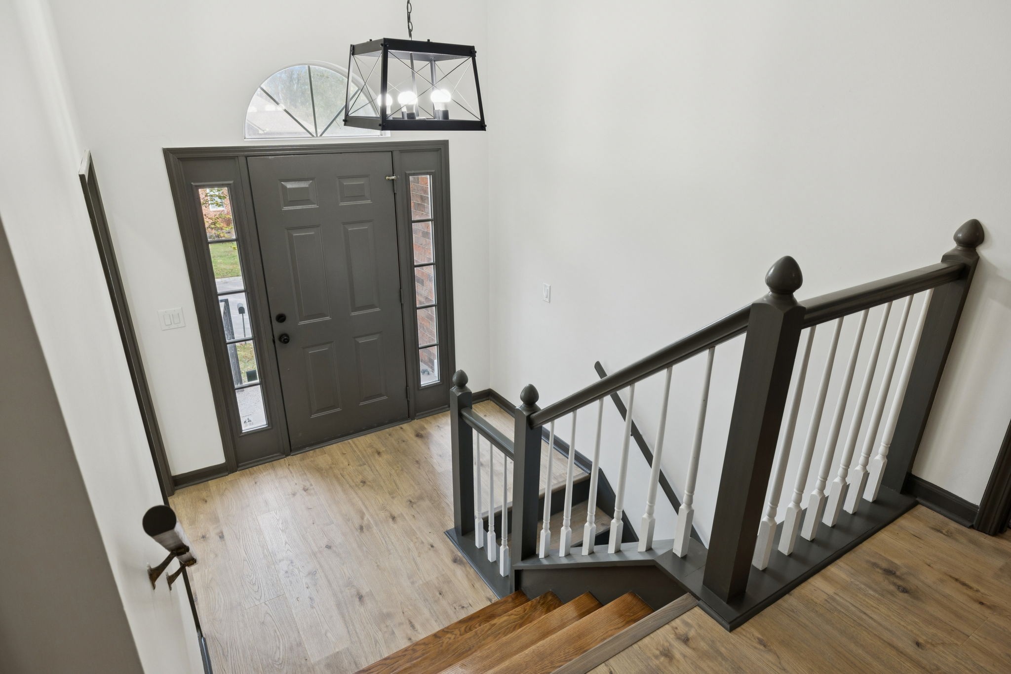 4612 Raccoon Trail Hermitage, TN 37076 - Photo 35 of 36 a view of a hallway with wooden floor and staircase