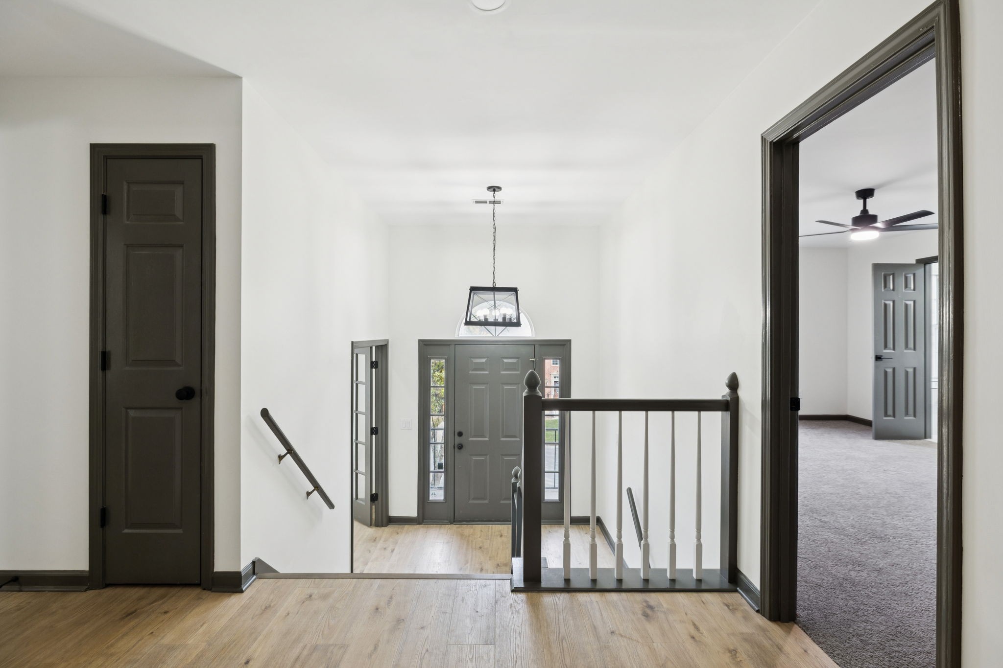 4612 Raccoon Trail Hermitage, TN 37076 - Photo 7 of 36 a view of hallway with stairs and wooden floor