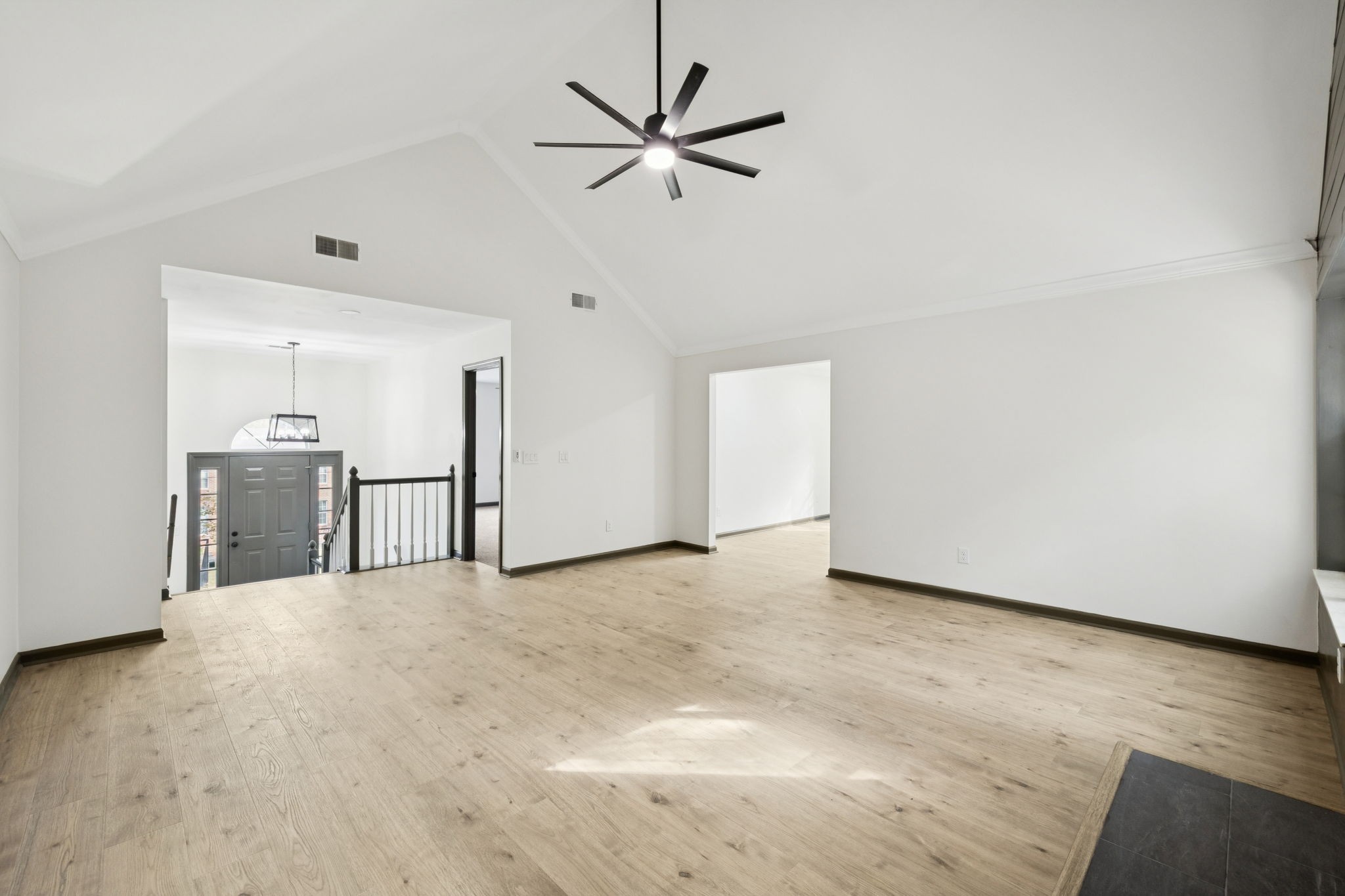 4612 Raccoon Trail Hermitage, TN 37076 - Photo 10 of 36 a view of a livingroom with a ceiling fan and kitchen space