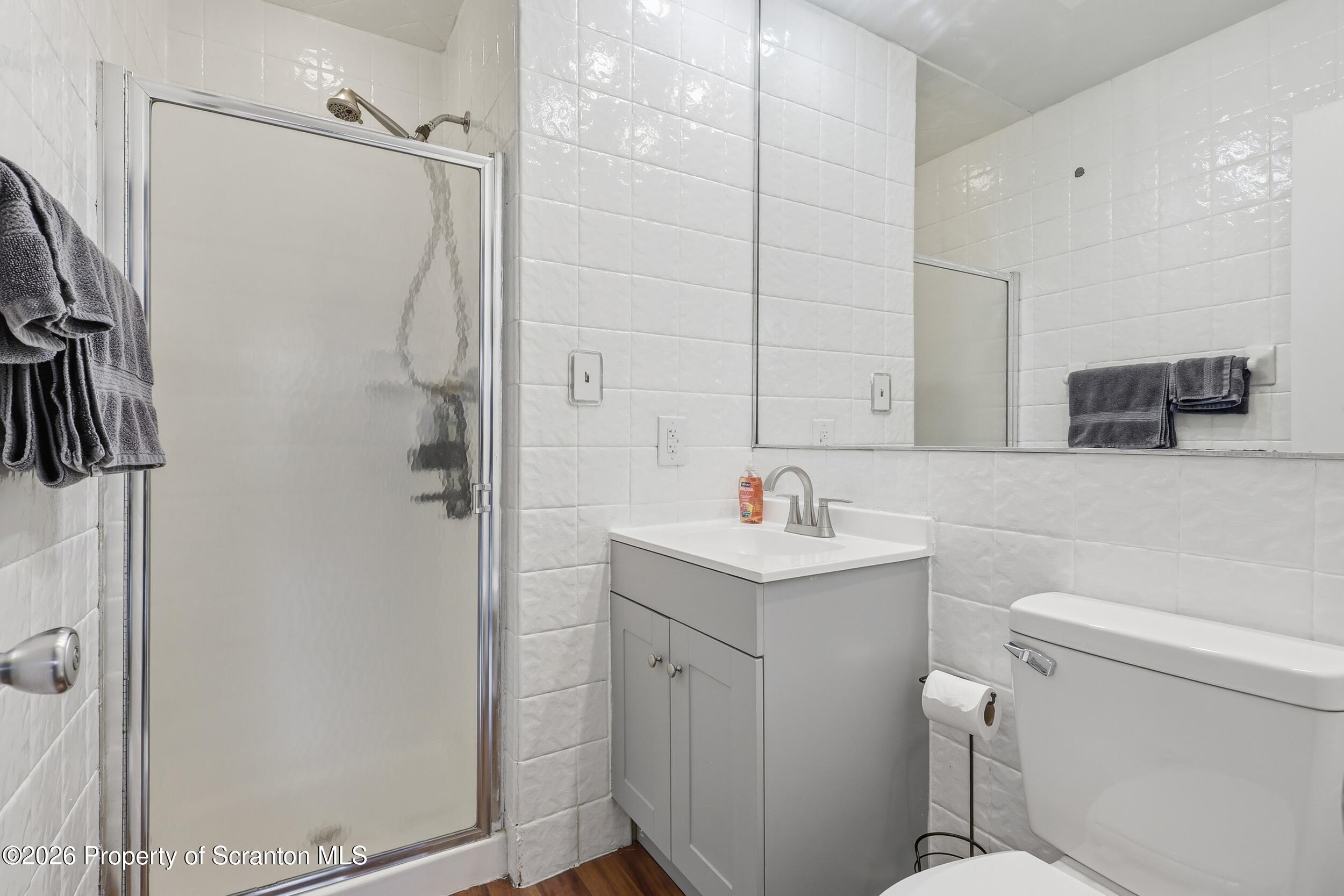 1379 Winding Way Tobyhanna, PA 18466 - Photo 16 of 51 a bathroom with a sink a toilet and shower