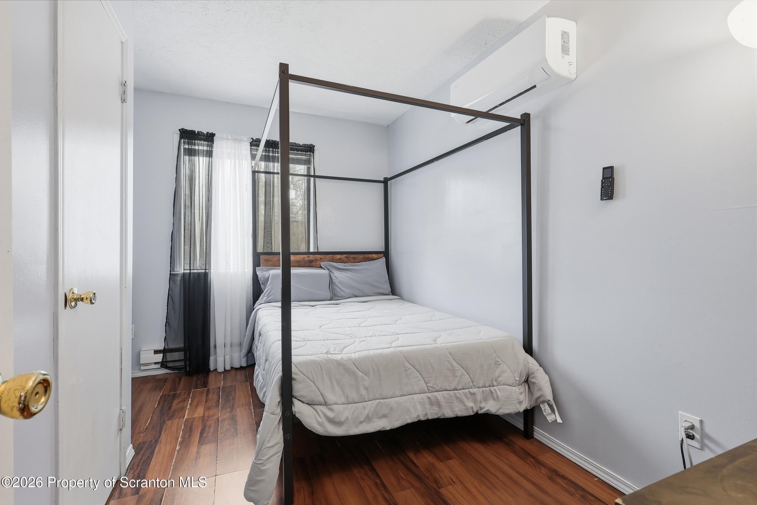 1379 Winding Way Tobyhanna, PA 18466 - Photo 19 of 51 a bedroom with a bed and wooden floor