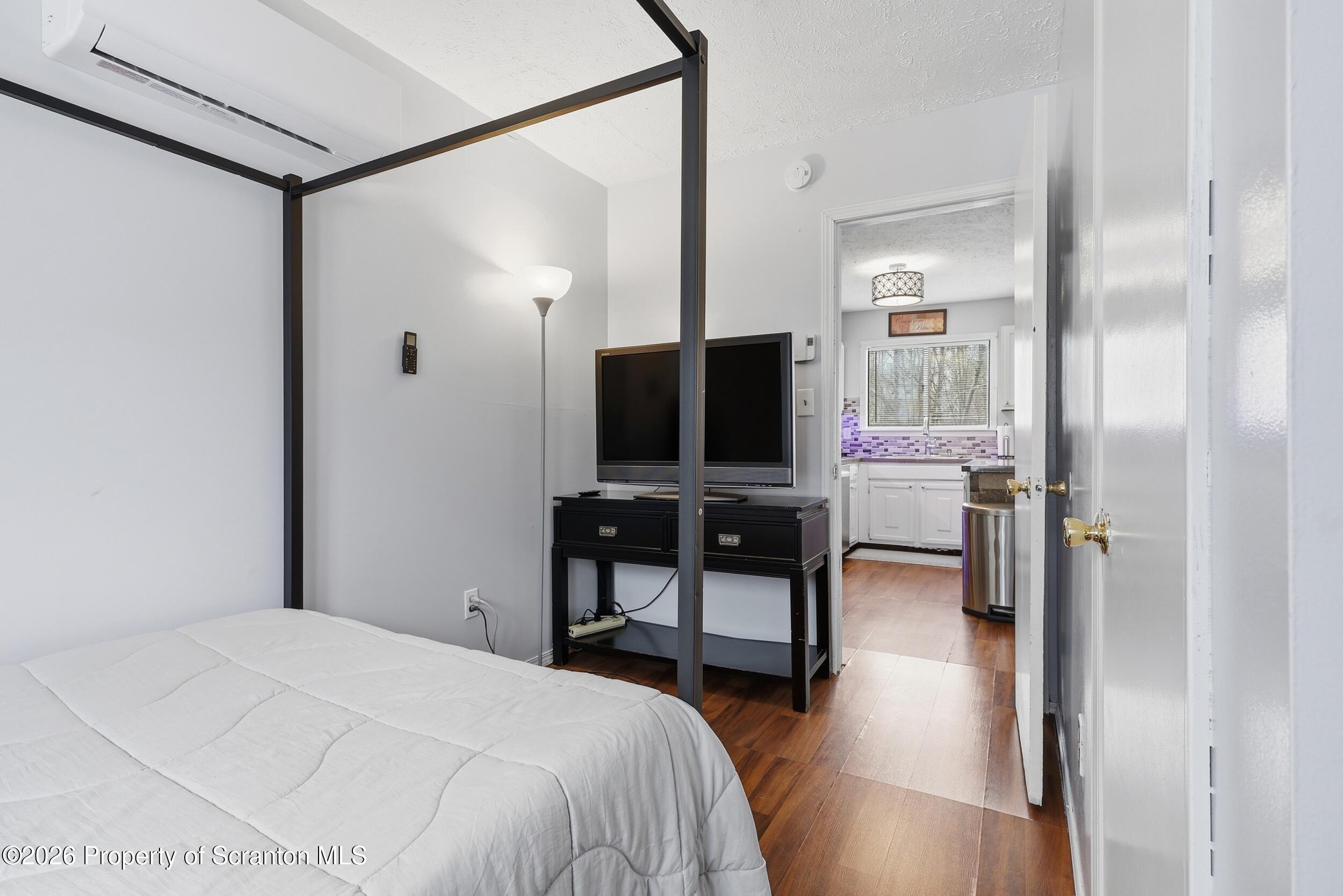 1379 Winding Way Tobyhanna, PA 18466 - Photo 20 of 51 a bedroom with a bed tv and chair