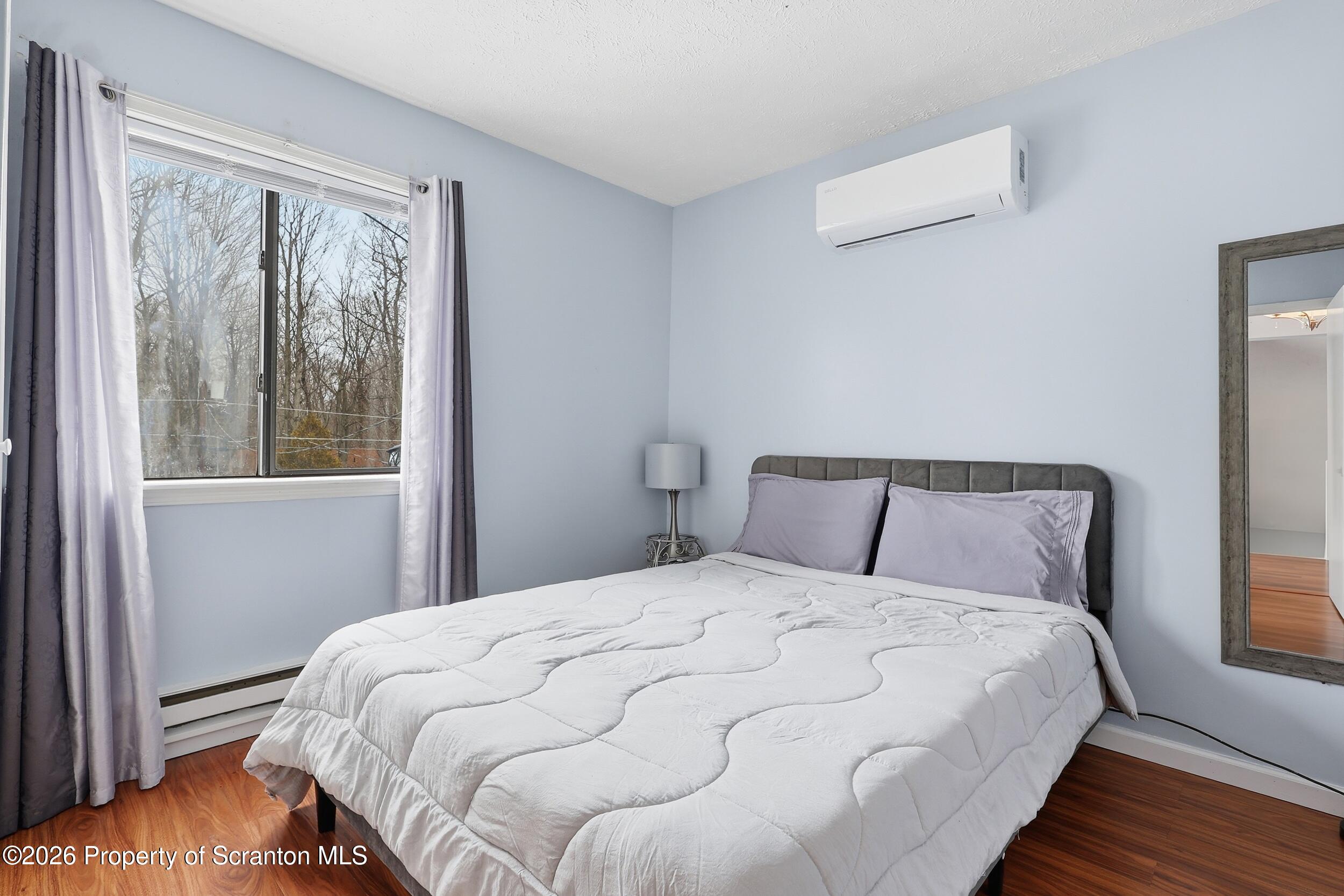 1379 Winding Way Tobyhanna, PA 18466 - Photo 22 of 51 a large bed sitting in a bedroom next to a window