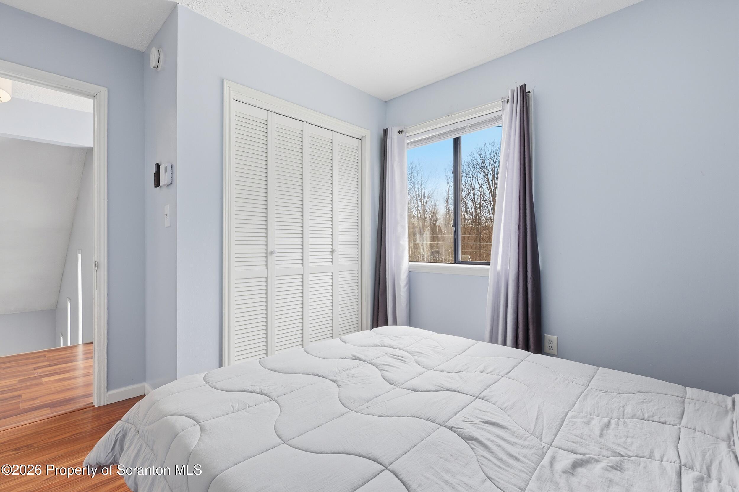 1379 Winding Way Tobyhanna, PA 18466 - Photo 23 of 51 a bedroom with a bed and a window