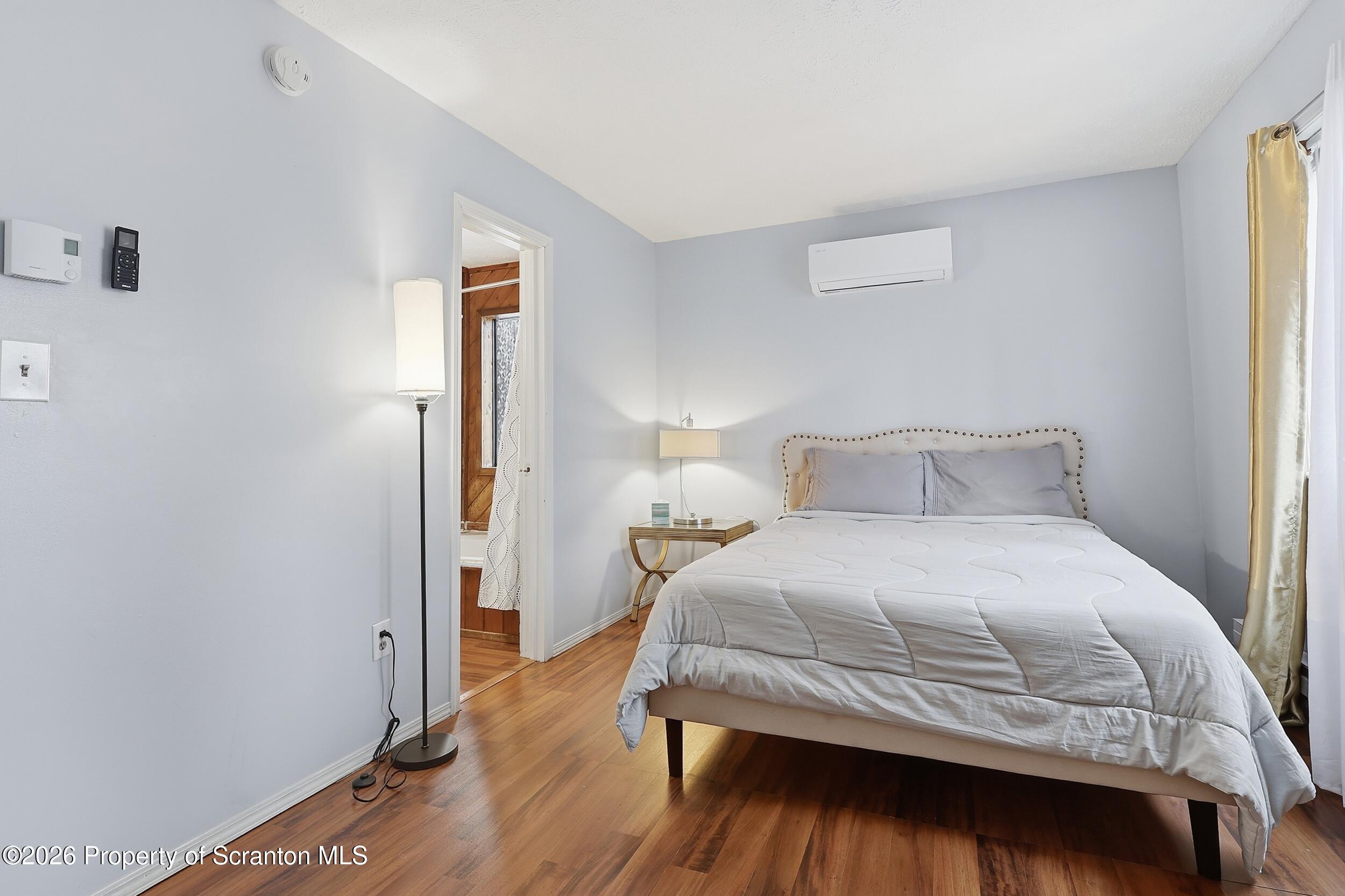 1379 Winding Way Tobyhanna, PA 18466 - Photo 26 of 51 a bedroom with a bed and wooden floor