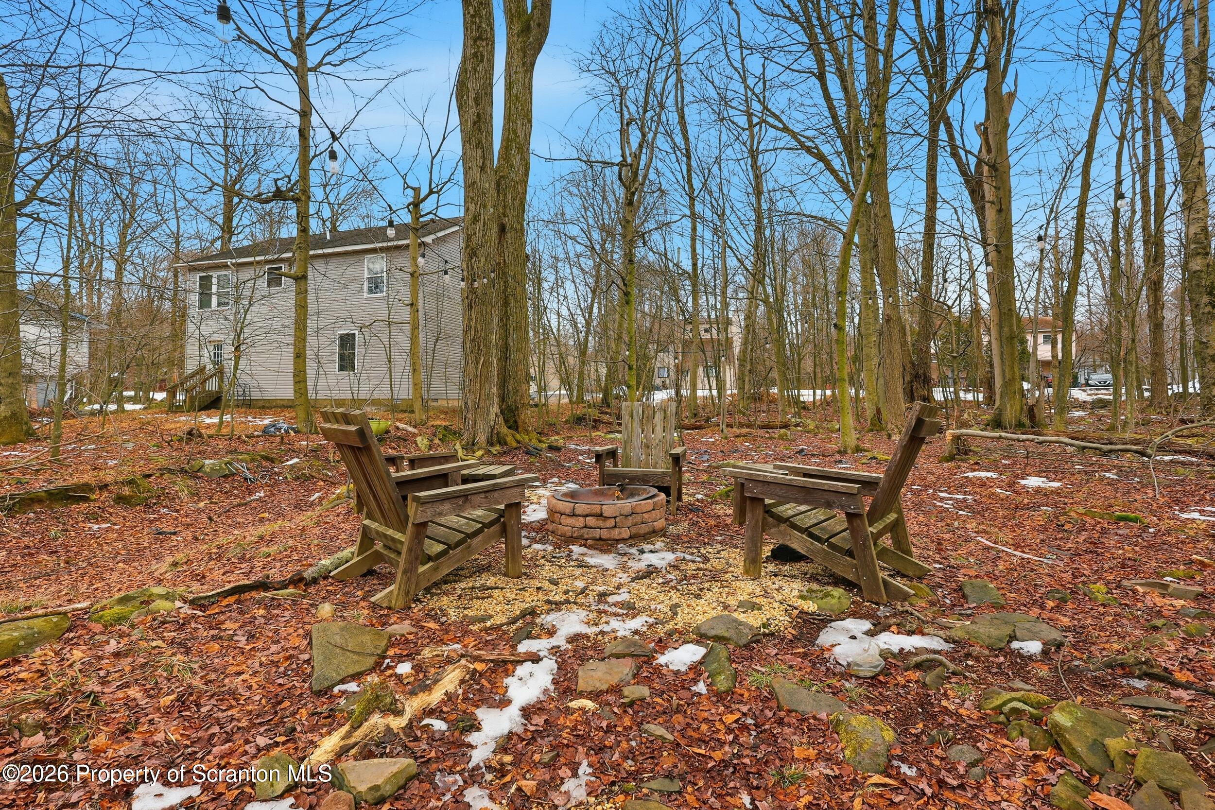1379 Winding Way Tobyhanna, PA 18466 - Photo 38 of 51 a backyard of a house with table and chairs