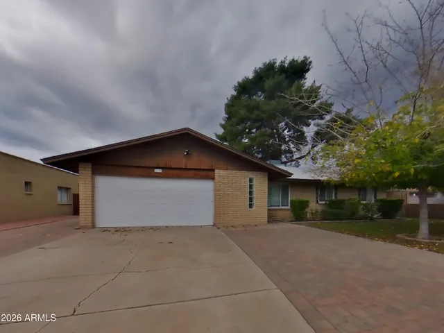 a view of garage and yard