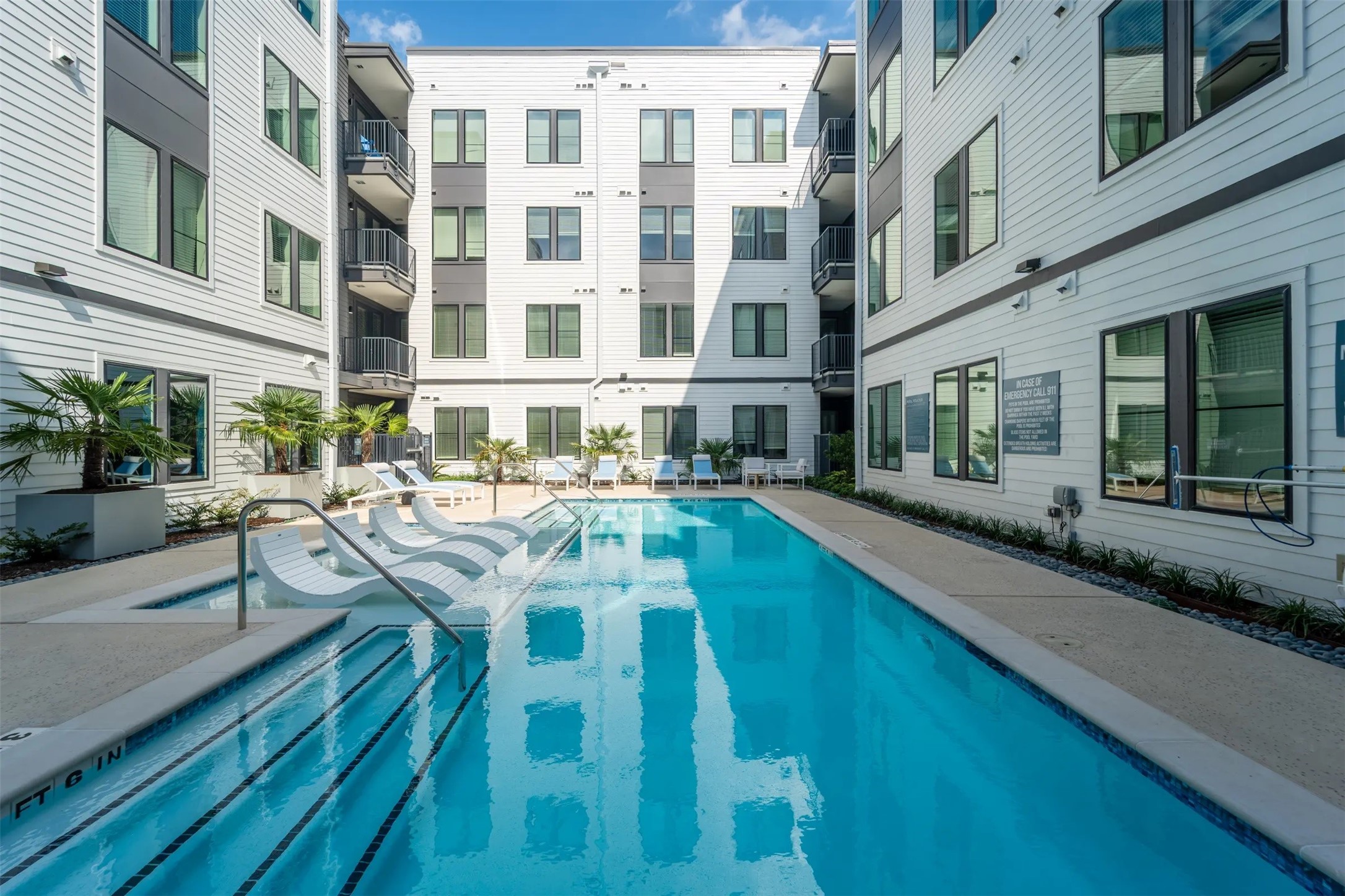 1690 North Loop, Unit 377 Houston, TX 77009 - Photo 17 of 28 a view of a swimming pool with outdoor seating