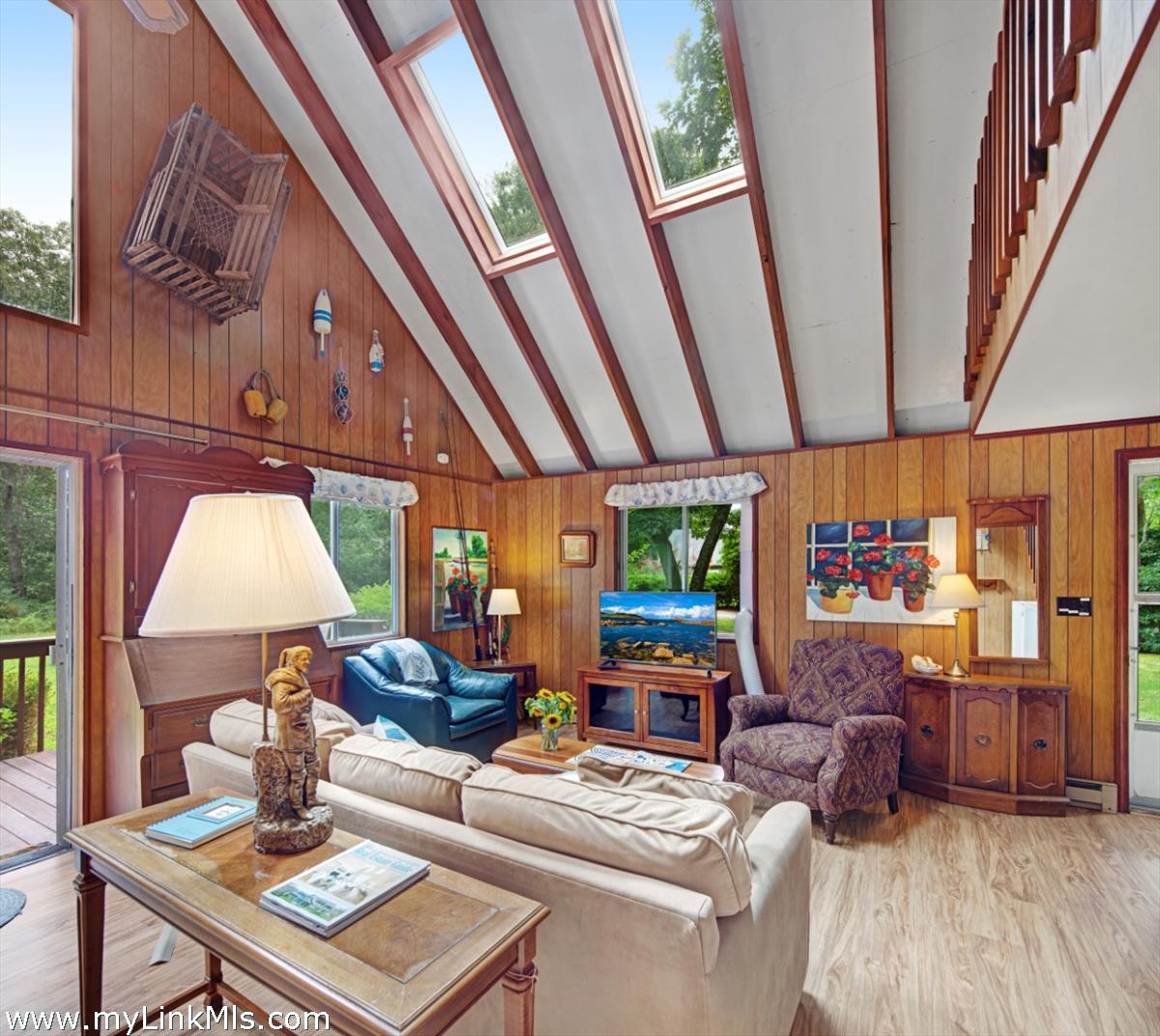 9 Galway Road West Tisbury, MA 02568 - Photo 11 of 26 a living room with furniture and a floor to ceiling window