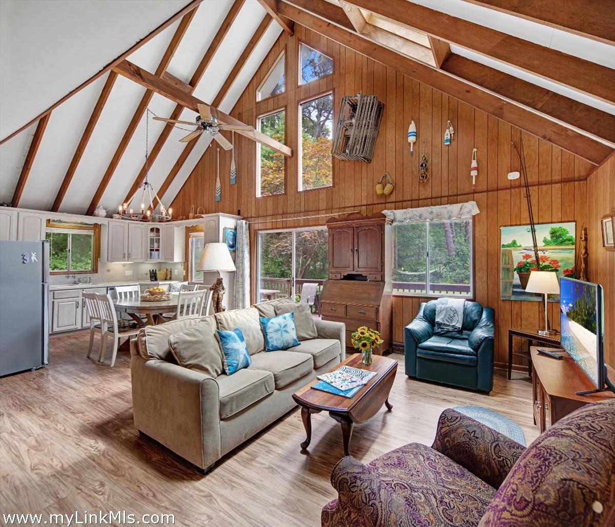 9 Galway Road West Tisbury, MA 02568 - Photo 12 of 26 a living room with furniture a fireplace and a table