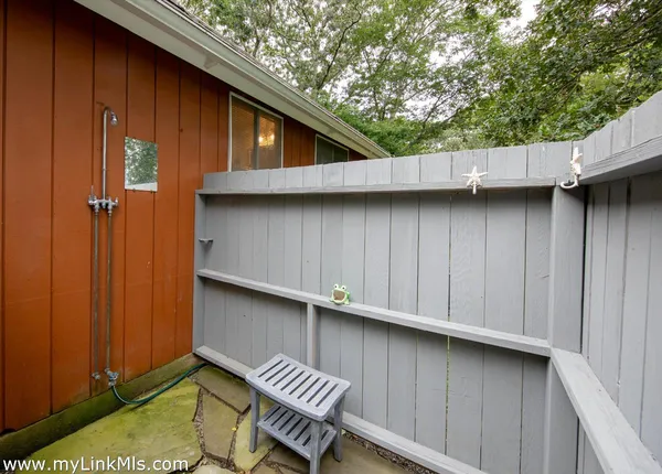 a view of backyard with outdoor seating