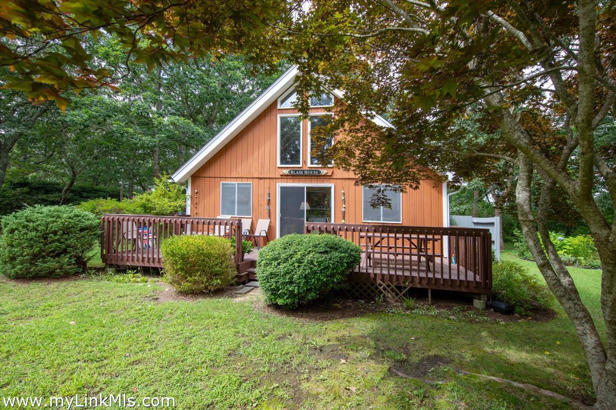 9 Galway Road West Tisbury, MA 02568 - Photo 4 of 26 a view of a house with backyard and a garden