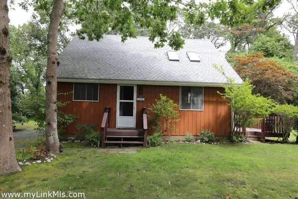 a front view of house with garden
