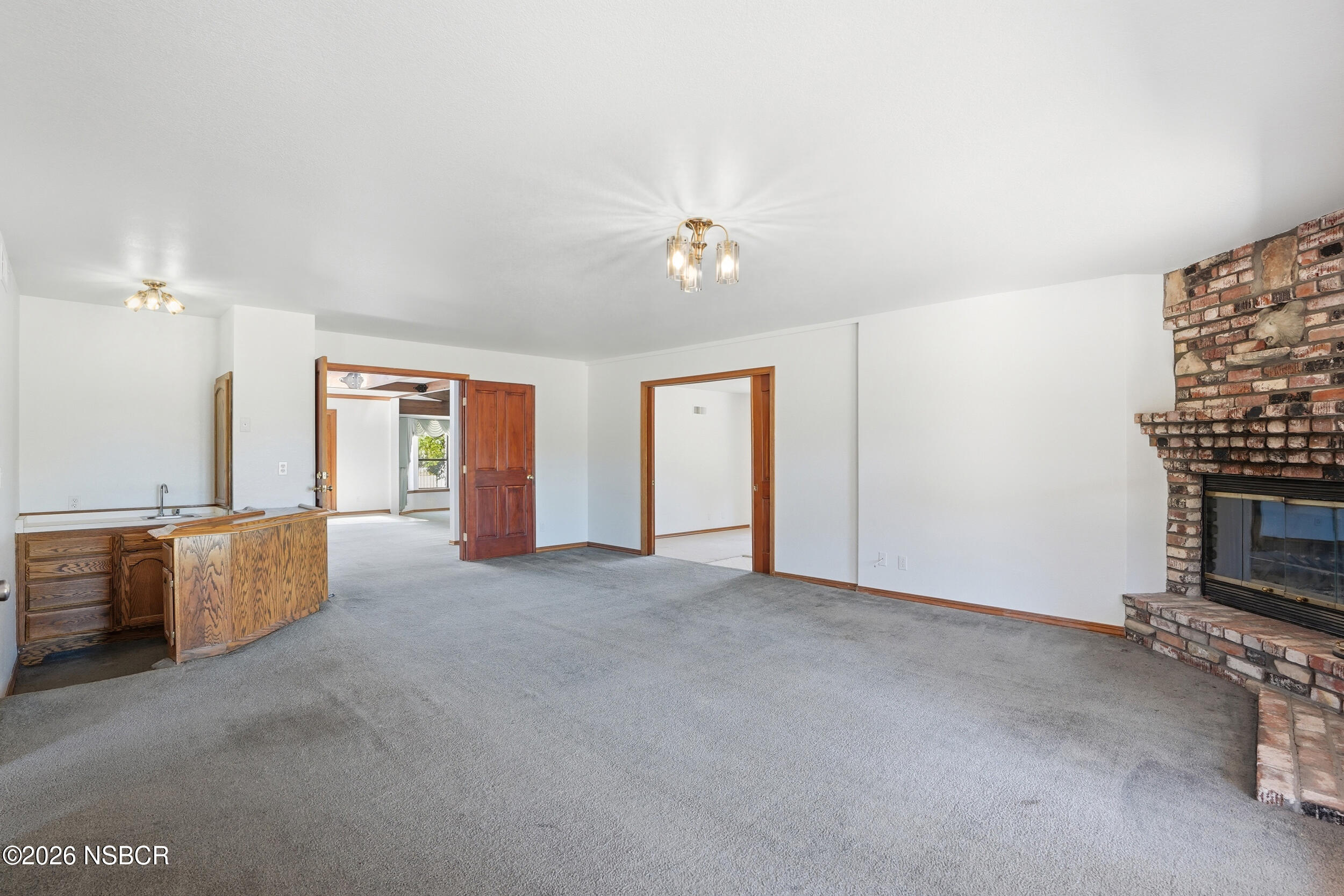 140 East Rice Ranch Road Santa Maria, CA 93455 - Photo 9 of 44 a view of an empty room with a fireplace
