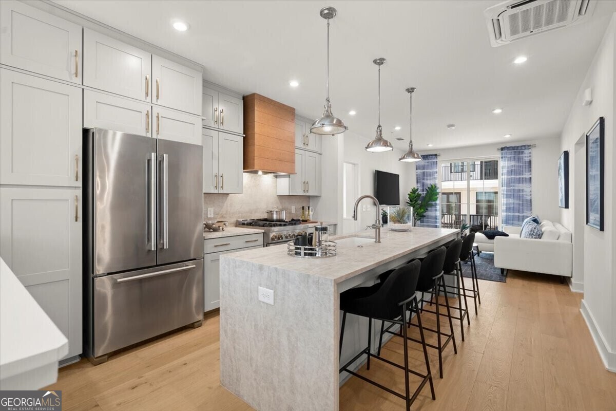 Photos are of similar McKoy plan, the decorated model.  Some features and selections may vary. Current McKoy does not have waterfall kitchen island