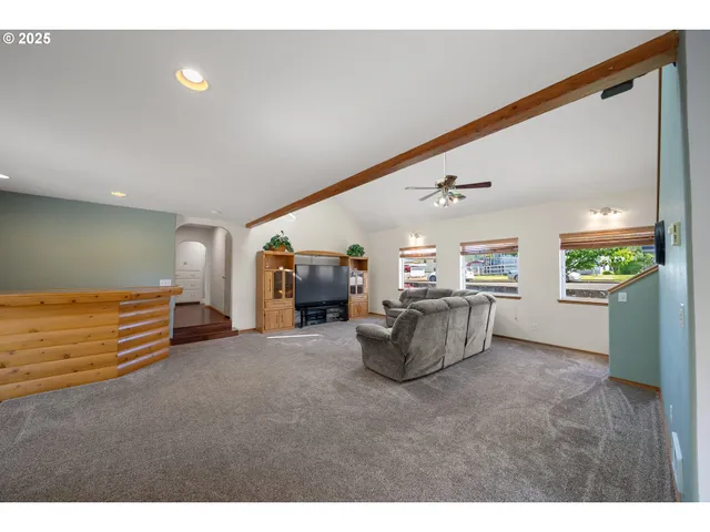 a view of living room filled with furniture and window