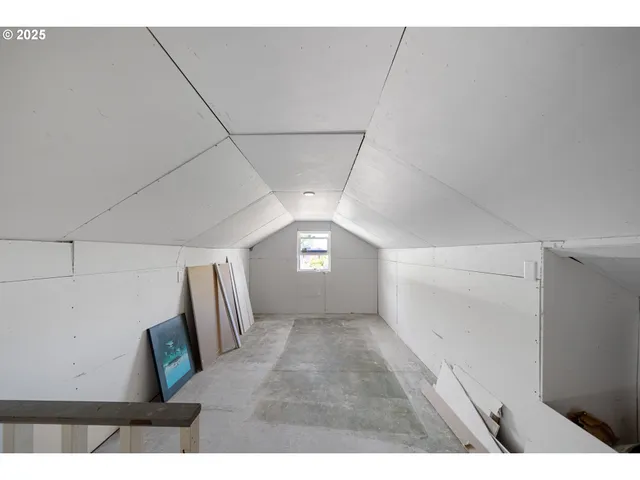 a picture of a room with a white wall and white cabinet