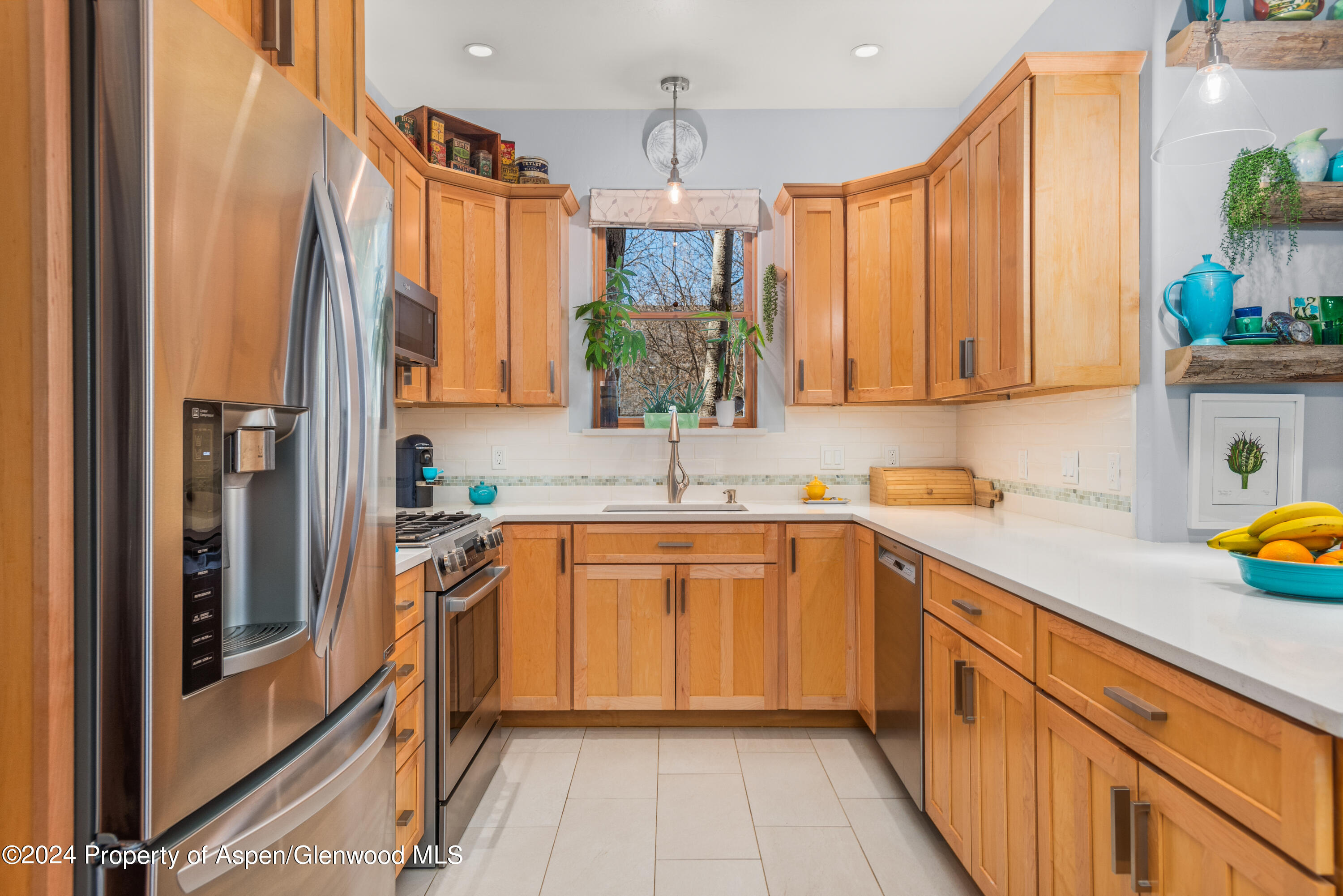 325 Summerset Lane, Unit A Basalt, CO 81621 - Photo 7 of 22 a kitchen with stainless steel appliances a sink stove and cabinets