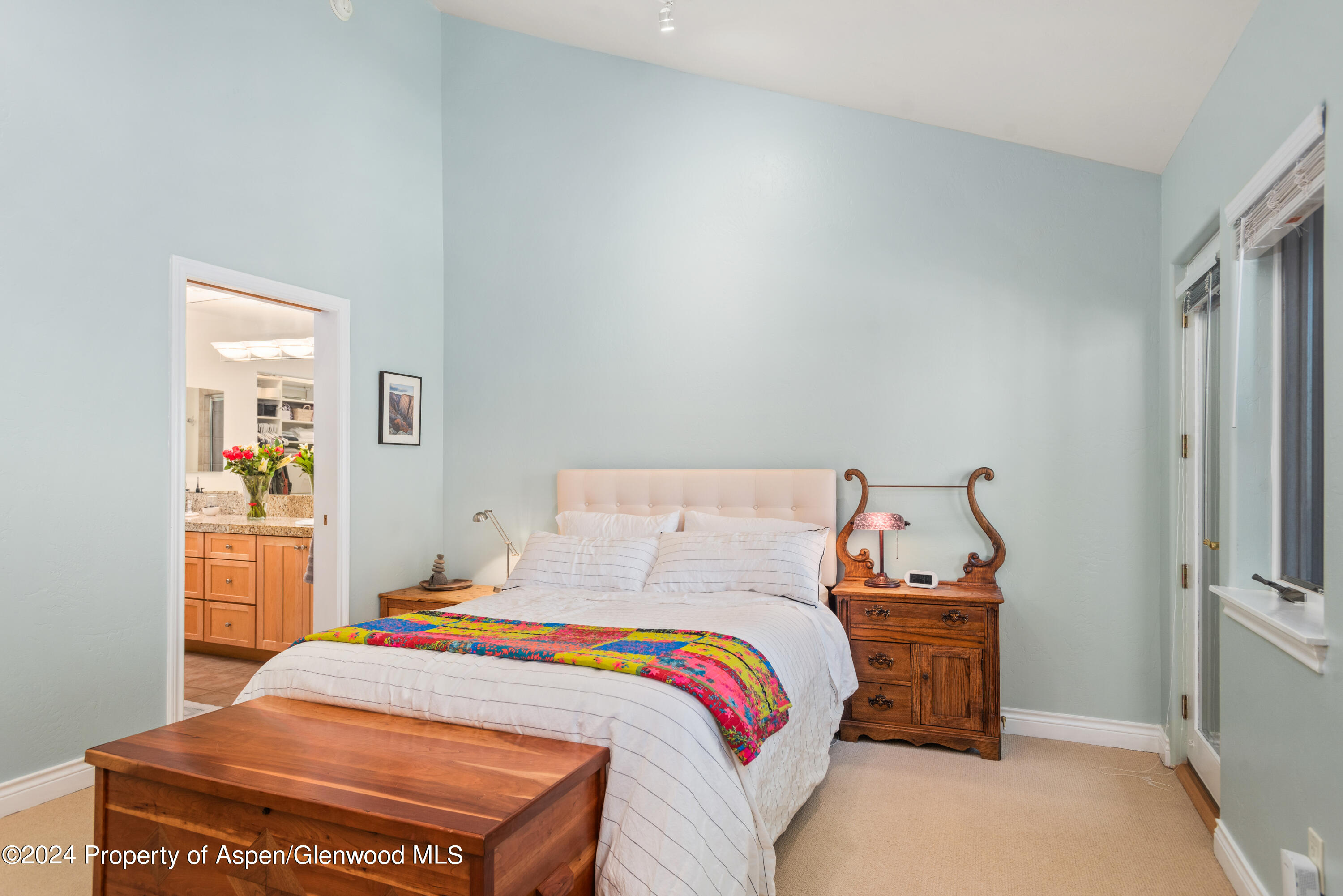 325 Summerset Lane, Unit A Basalt, CO 81621 - Photo 9 of 22 a bed sitting in a bedroom next to a window