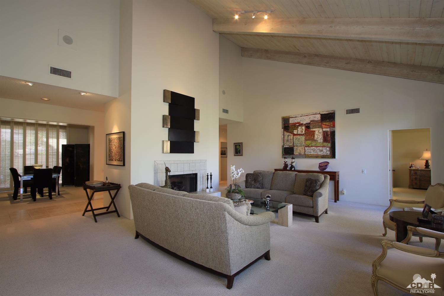 927 Inverness Drive Rancho Mirage, CA 92270 - Photo 15 of 42 a living room with furniture and a flat screen tv