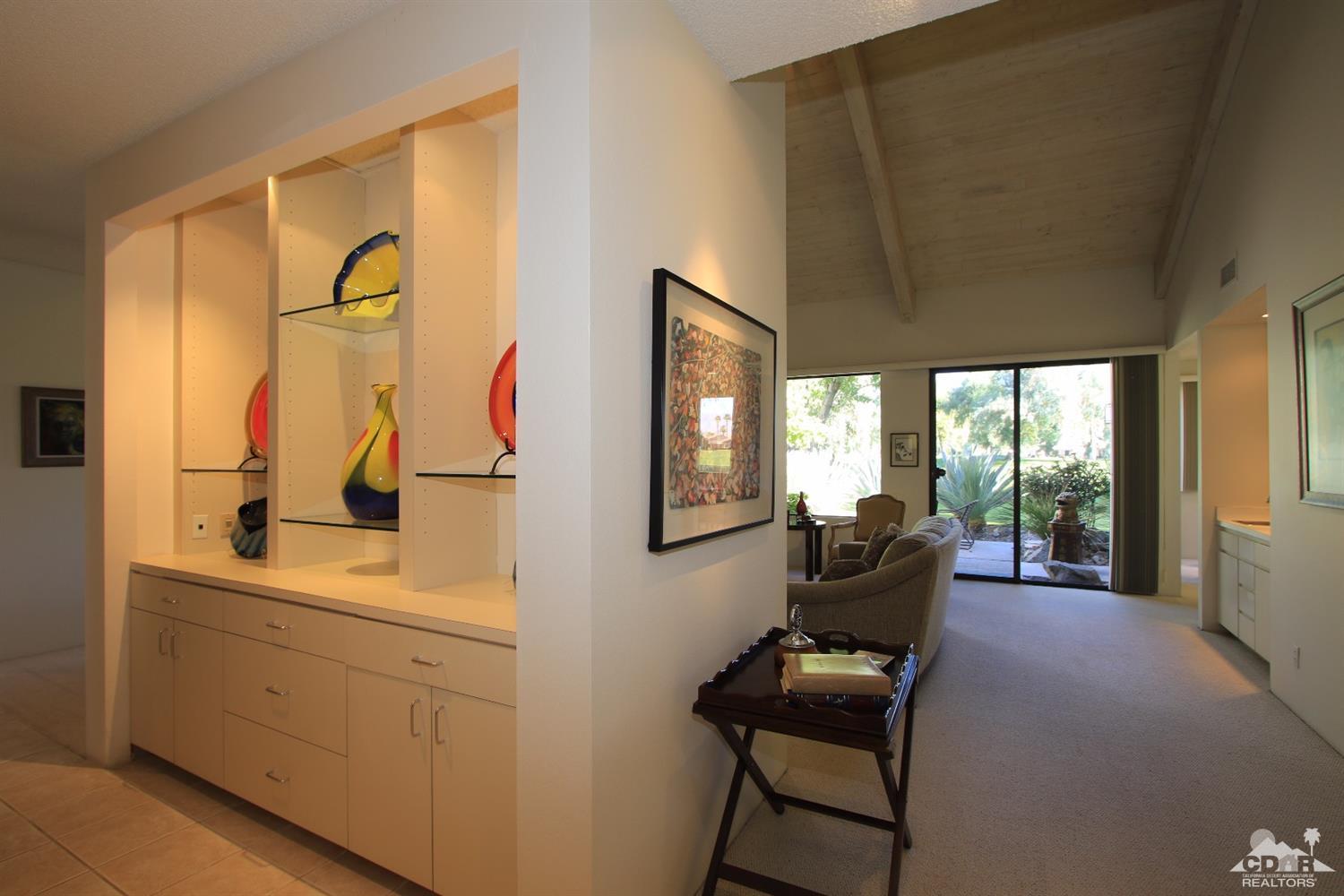 927 Inverness Drive Rancho Mirage, CA 92270 - Photo 16 of 42 a living room with furniture and a window