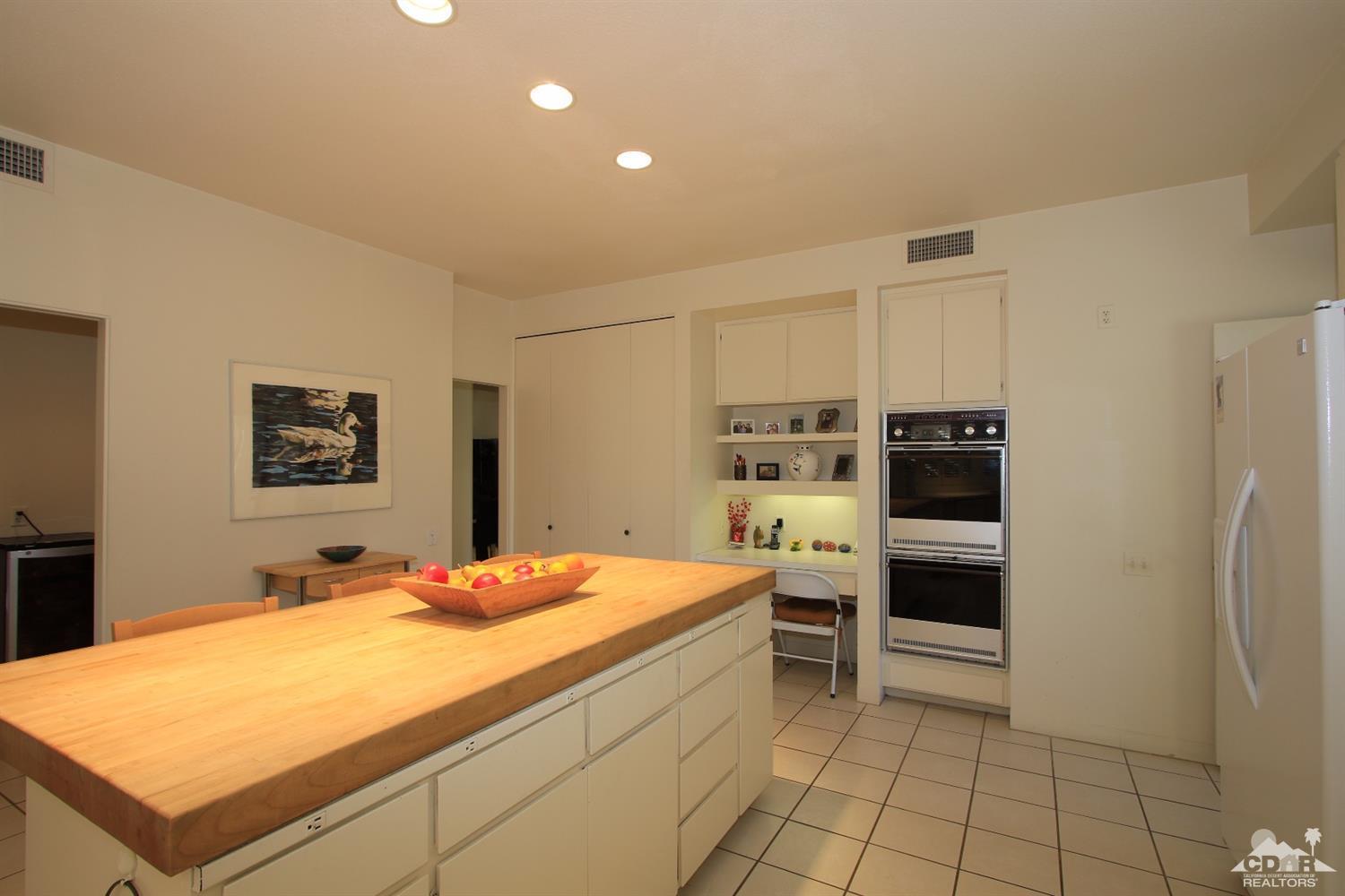927 Inverness Drive Rancho Mirage, CA 92270 - Photo 18 of 42 a room with a stove and a refrigerator