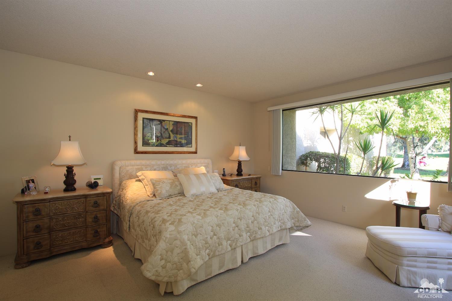 927 Inverness Drive Rancho Mirage, CA 92270 - Photo 20 of 42 a bedroom with bed and a large window
