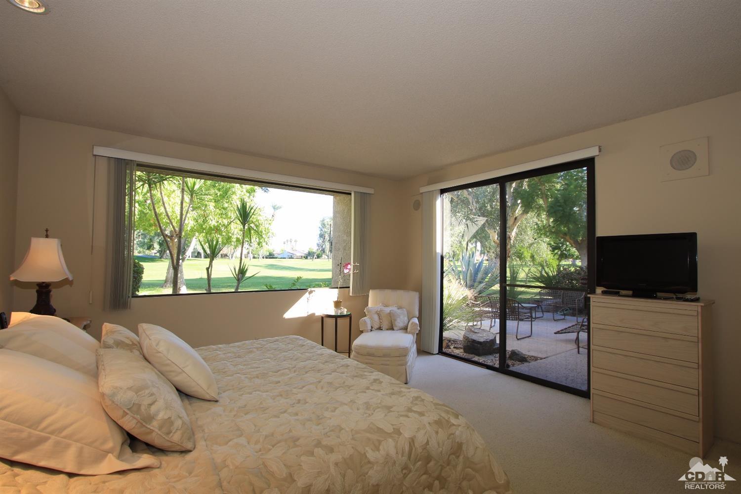 927 Inverness Drive Rancho Mirage, CA 92270 - Photo 21 of 42 a bed sitting in a bedroom next to a window