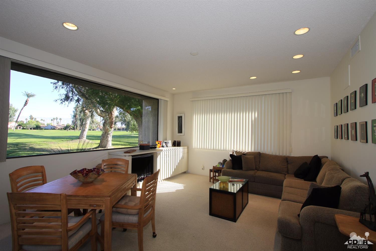 927 Inverness Drive Rancho Mirage, CA 92270 - Photo 4 of 42 a living room with furniture and a large window