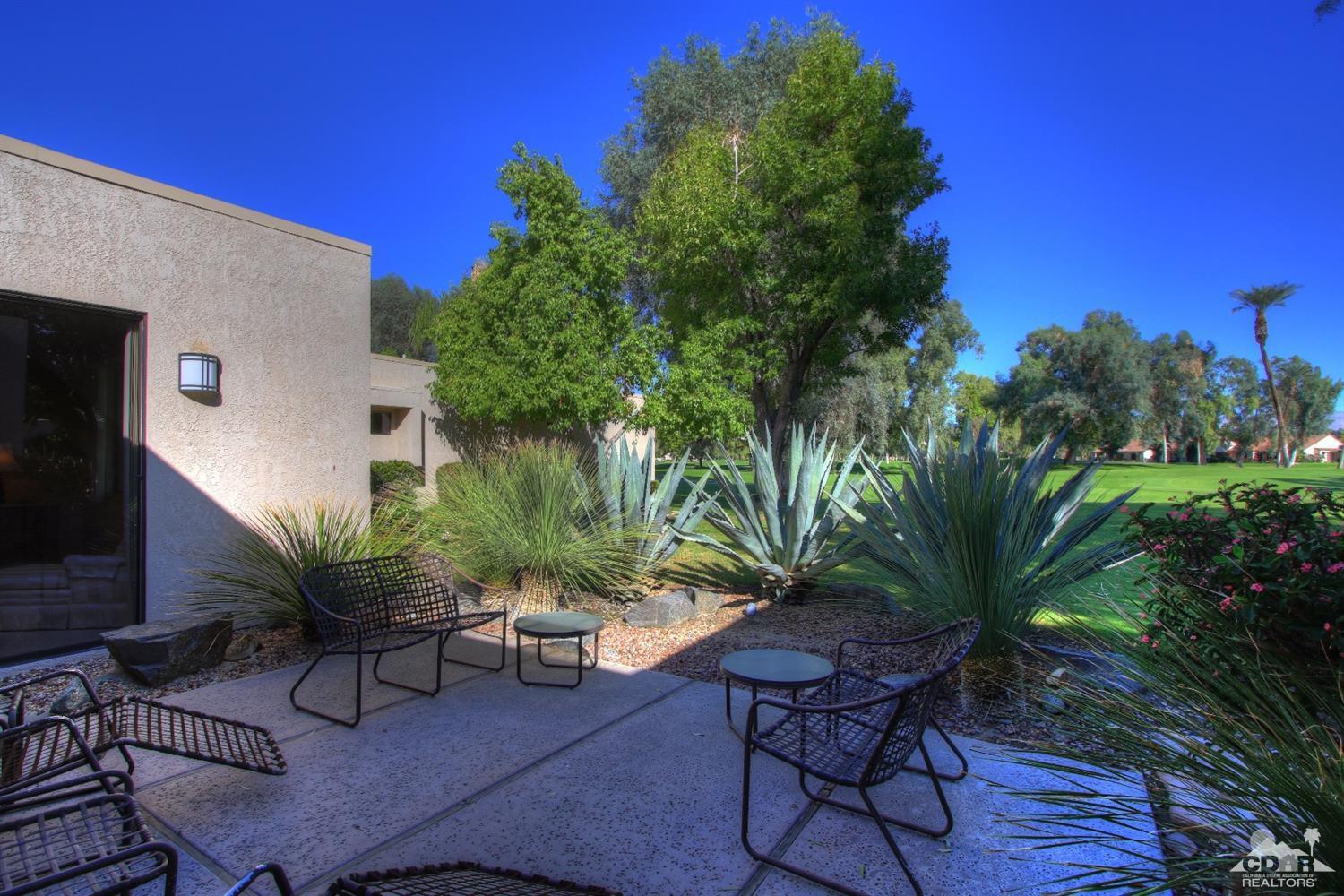 927 Inverness Drive Rancho Mirage, CA 92270 - Photo 36 of 42 a view of a chairs and table in a patio