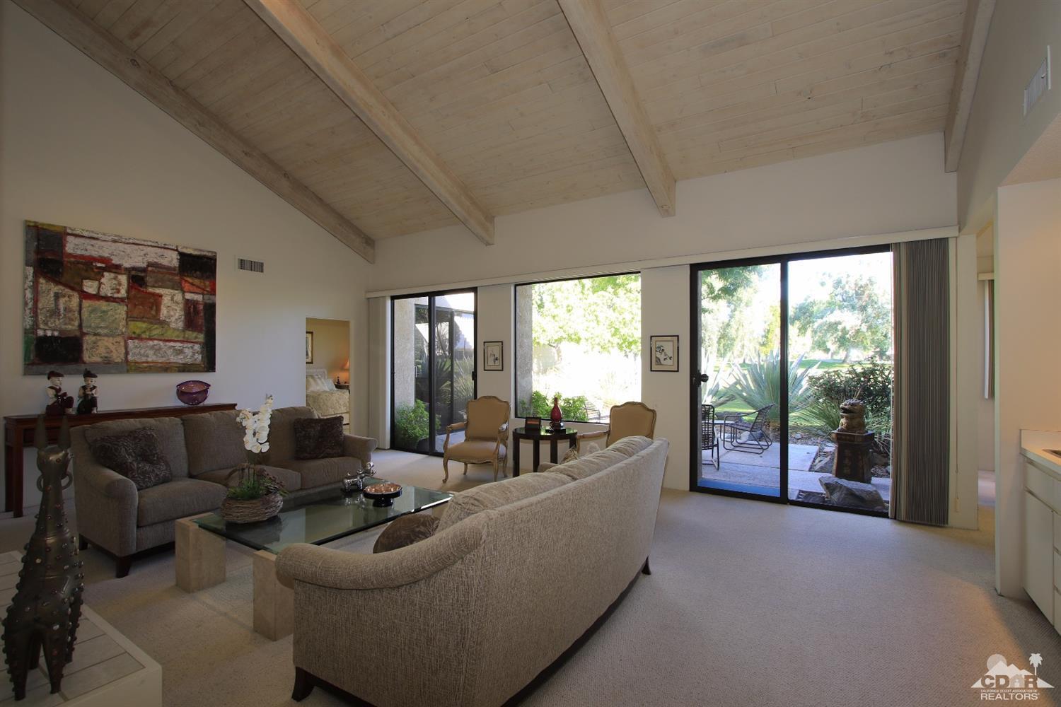 927 Inverness Drive Rancho Mirage, CA 92270 - Photo 7 of 42 a living room with furniture and a large window