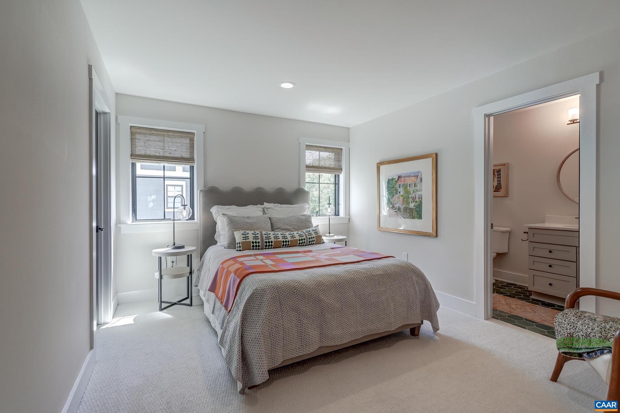 3327 Rowcross Street Crozet, VA 22932 - Photo 36 of 63 a bedroom with a bed and a flat screen tv