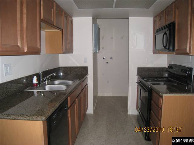 50 Griswold Way Reno, NV 89503 - Photo 4 of 9 a kitchen that has a sink and a stove