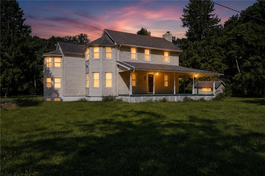 2882 Locust Ridge Road Pocono Lake, PA 18347 - Photo 1 of 45 A classic facade with a welcoming covered porch, perfect for twilight enjoyment.