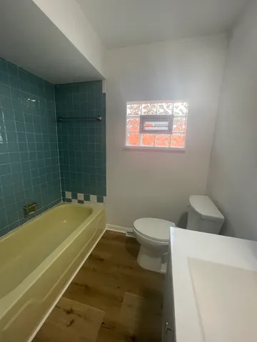 a bathroom with a sink a bathtub and a toilet