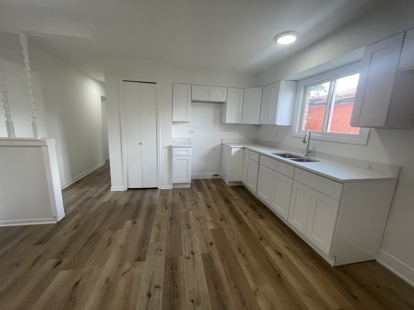 2220 West 158th Street Markham, IL 60426 - Photo 7 of 21 a kitchen with wooden floors and white appliances