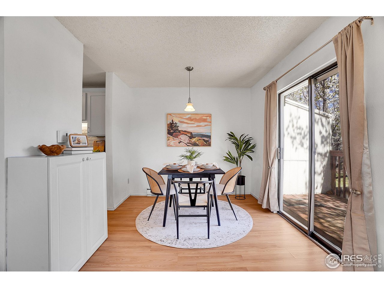 1209 Centaur Circle, Unit B Lafayette, CO 80026 - Photo 11 of 36 a dining room with furniture window and wooden floor