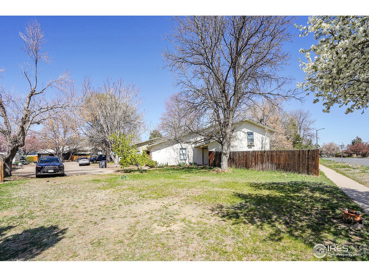 1209 Centaur Circle, Unit B Lafayette, CO 80026 - Photo 31 of 36 a view of a yard with a house and a big yard