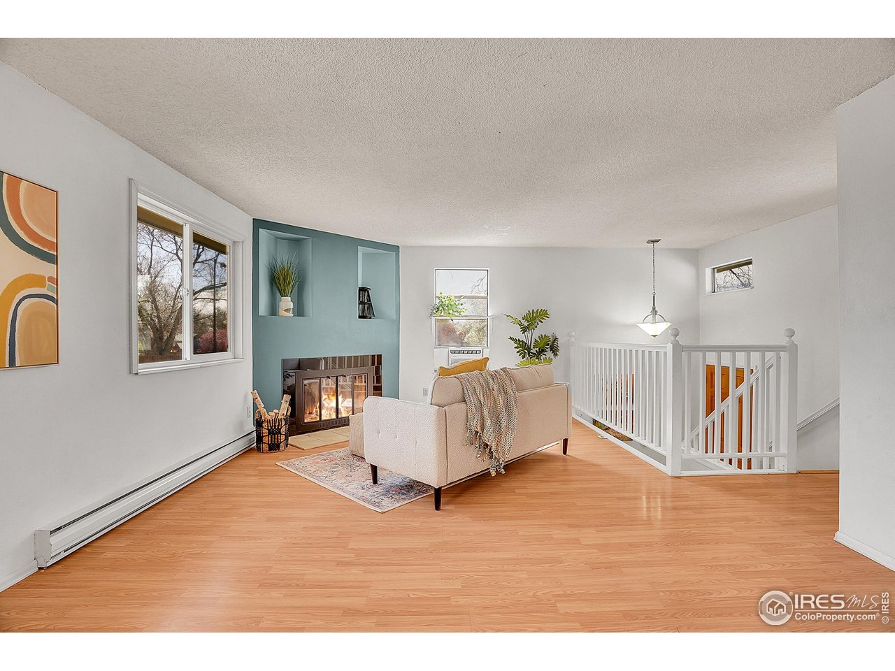 1209 Centaur Circle, Unit B Lafayette, CO 80026 - Photo 6 of 36 a living room with furniture and a wooden floor