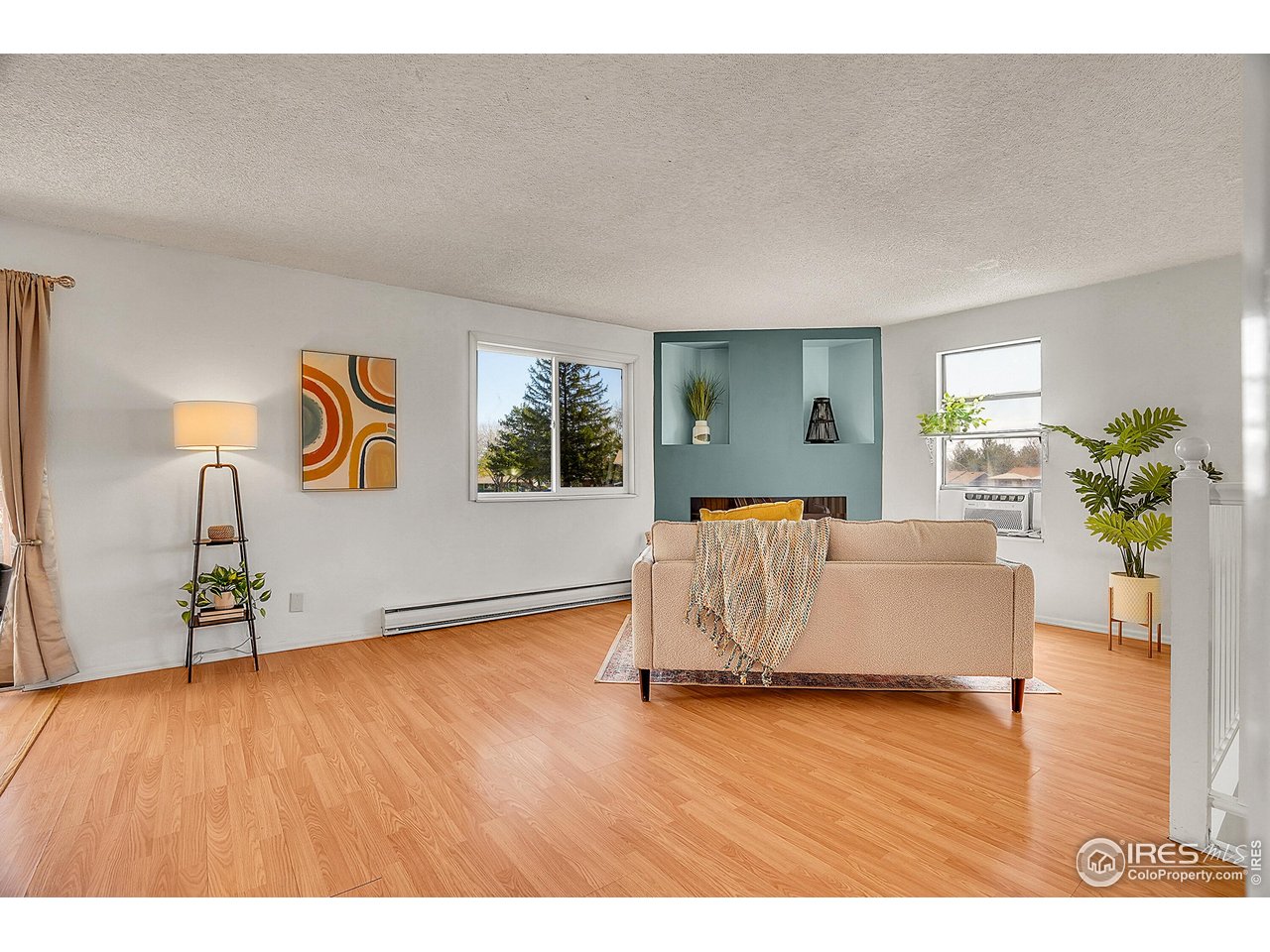 1209 Centaur Circle, Unit B Lafayette, CO 80026 - Photo 7 of 36 a living room with furniture and a wooden floor