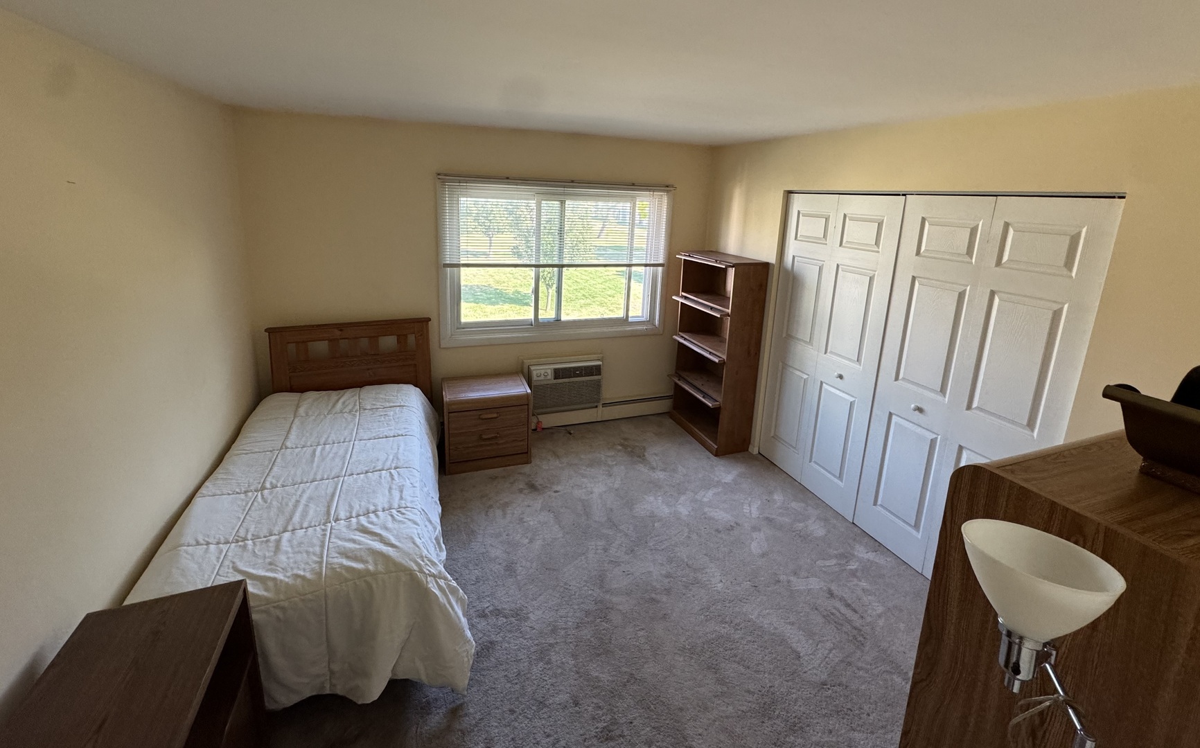 8804 Golf Road, Unit 2F Des Plaines, IL 60016 - Photo 6 of 8 a bedroom with furniture and a window
